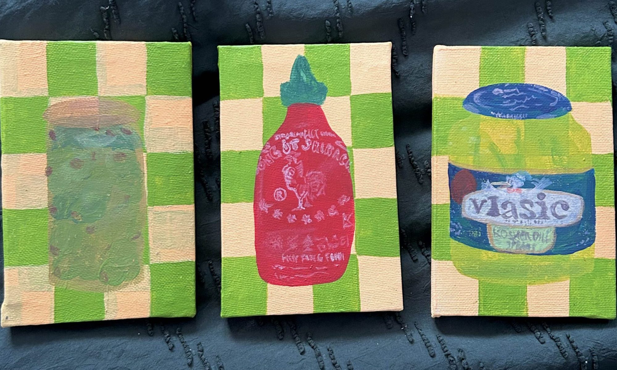 3 checkered canvases with green and light yellow, each canvas with (from left to right) an olive jar, sriracha bottle, and pickle jar.